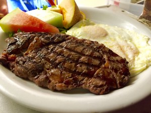 Sizzling Dish of Steak and Eggs from Ed's Place