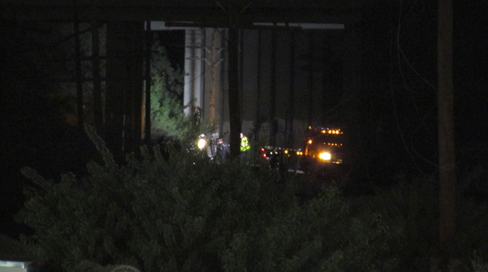 Workers drove along the tracks westbound to retrieve the van under the bridge. Photo by Aaron Castrejon.