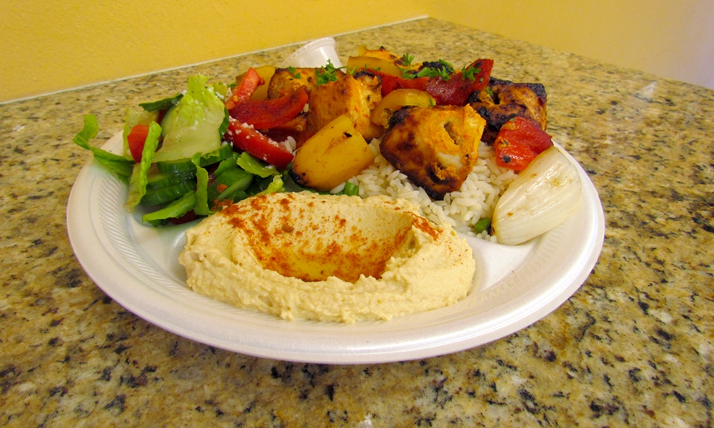 The Chicken Kabob plate comes with six pieces of chicken, salad, rice, hummos and two pita breads. Photo by Aaron Castrejon.