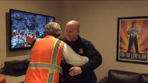 Det. Zach Houser hugged by Steve Hunt in a show of appreciation at the quick work finding the suspect